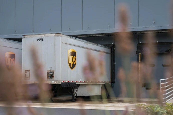 A truck is parked in front of a building